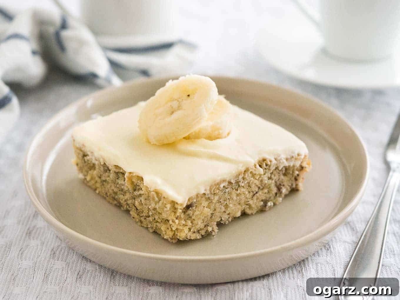 Easy Banana Cake - this fluffy and moist sheet cake has a mascarpone frosting on top and is ready in under 30 mins! A perfect cake to use overripe bananas.