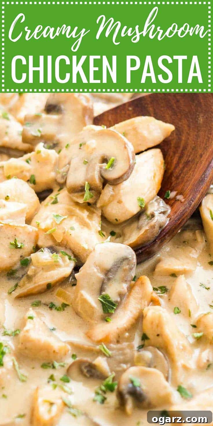 Close-up of Mushroom Chicken Pasta sauce with cream with a wooden cooking spoon in it, garnished with parsley, ready to be served.