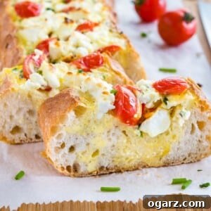 Appetizing slice of Tomato Feta Stuffed French Bread showcasing its delicious filling.