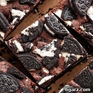Sliced brownies on parchment paper.
