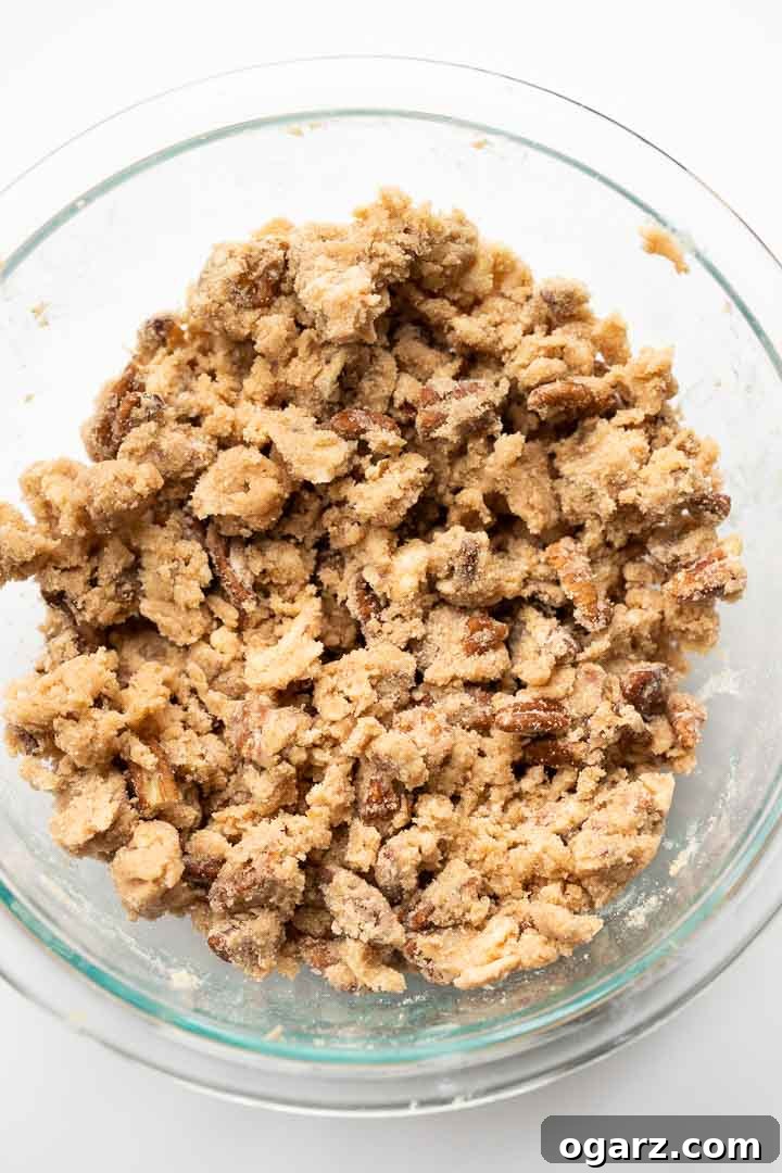 Close-up of the delicious streusel-pecan mixture in a glass bowl, ready to be sprinkled over the French toast casserole.