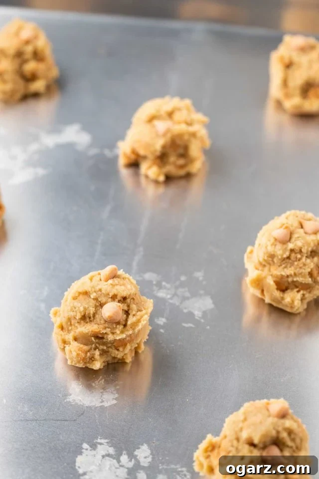 balls of butterscotch cookie dough on a baking sheet
