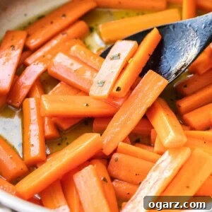 Carrots in a large skillet glazed with honey