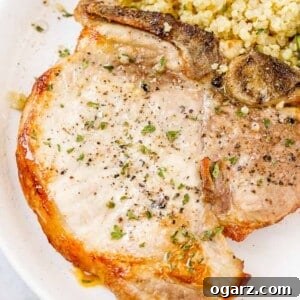 A plate of food, with Pork chop