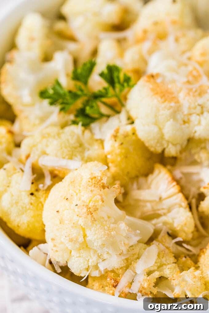 Golden Roasted Cauliflower 4 A close up shot of roasted cauliflower garnished with fresh parsley