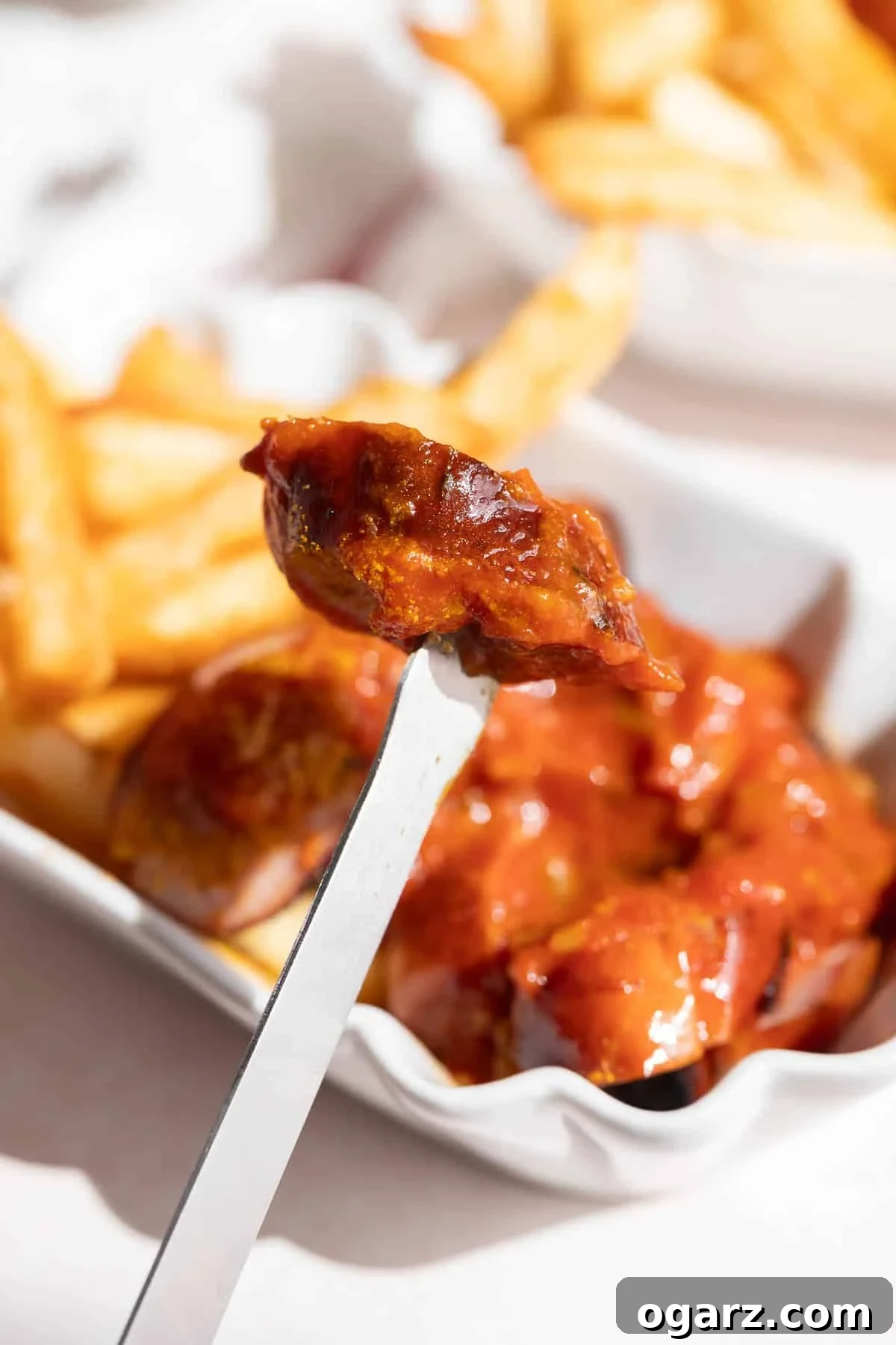 A sausage piece on a skewer.